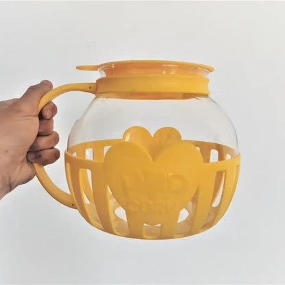 Yellow silicone and clear glass popcorn maker kitchen colander lid