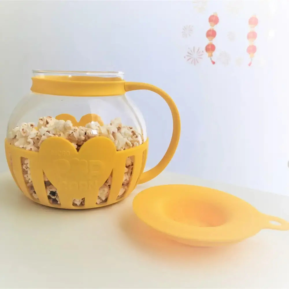 Yellow silicone and clear glass popcorn maker kitchen colander lid
