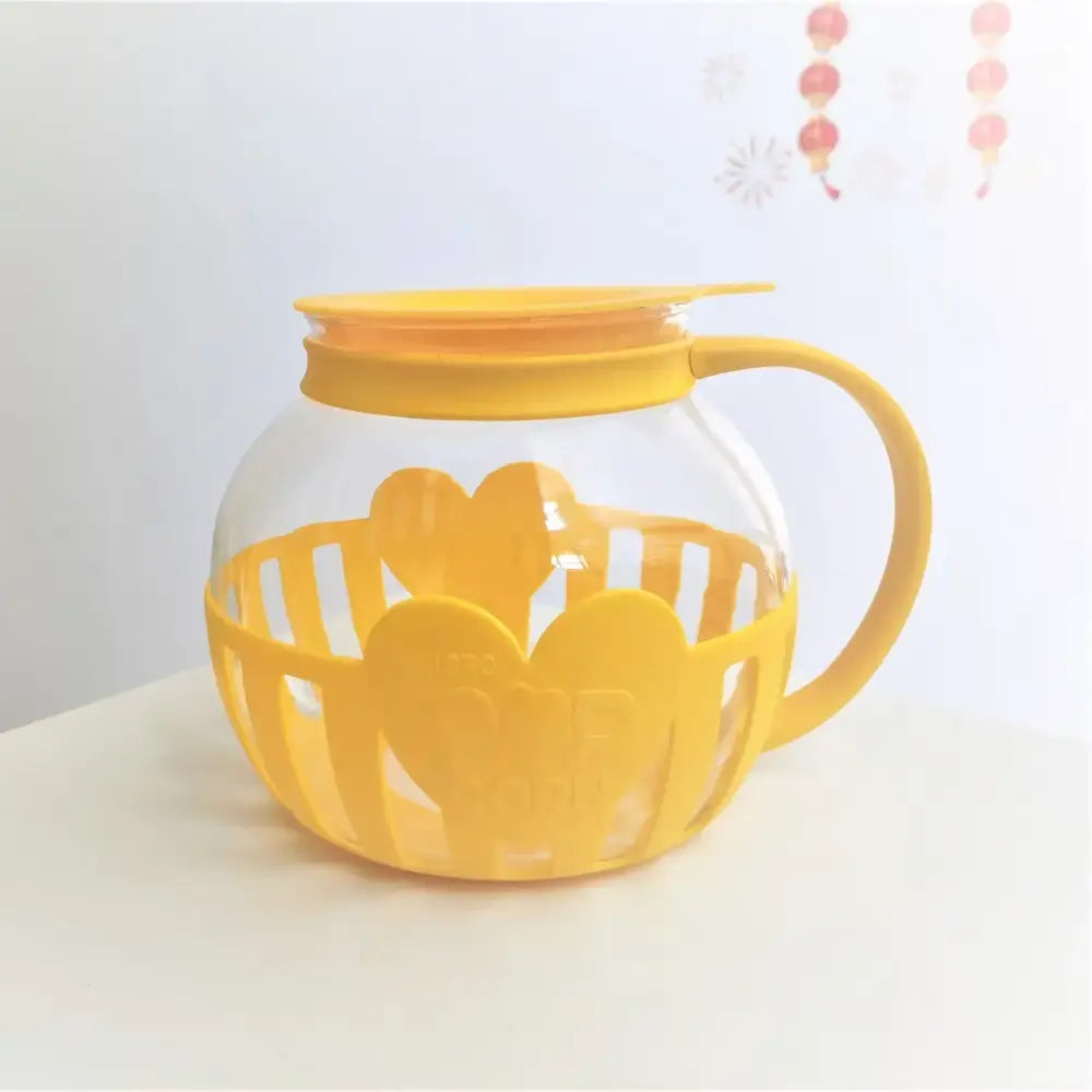 Yellow silicone and clear glass popcorn maker kitchen colander lid