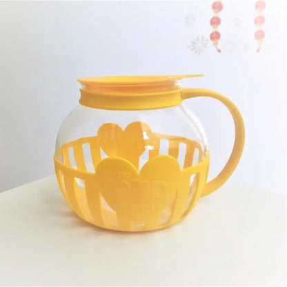 Yellow silicone and clear glass popcorn maker kitchen colander lid